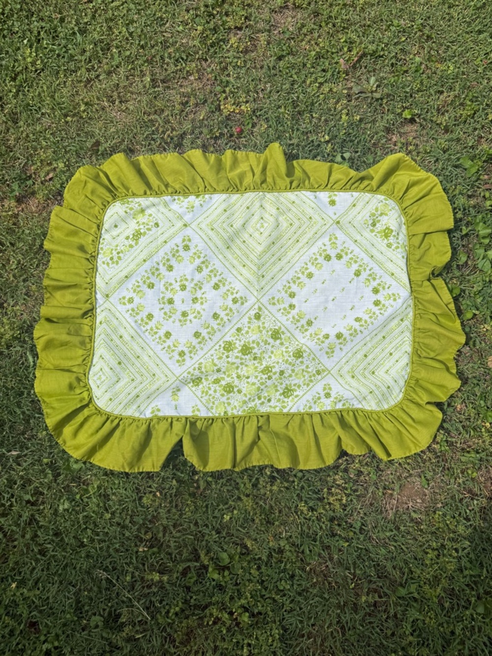 Vintage green floral print ruffle pillow sham.